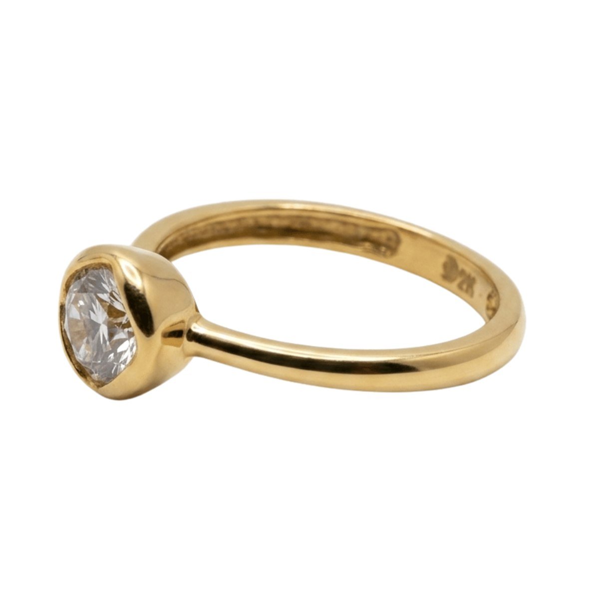 Bezel-set solitaire ring in 22K gold